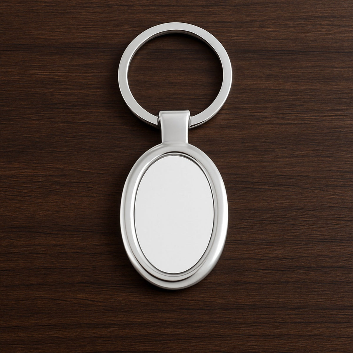 Sleek oval metal keychain showcasing durable build and chrome shine