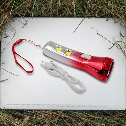 Portable LED torchlight resting on a flat surface, ready for use.