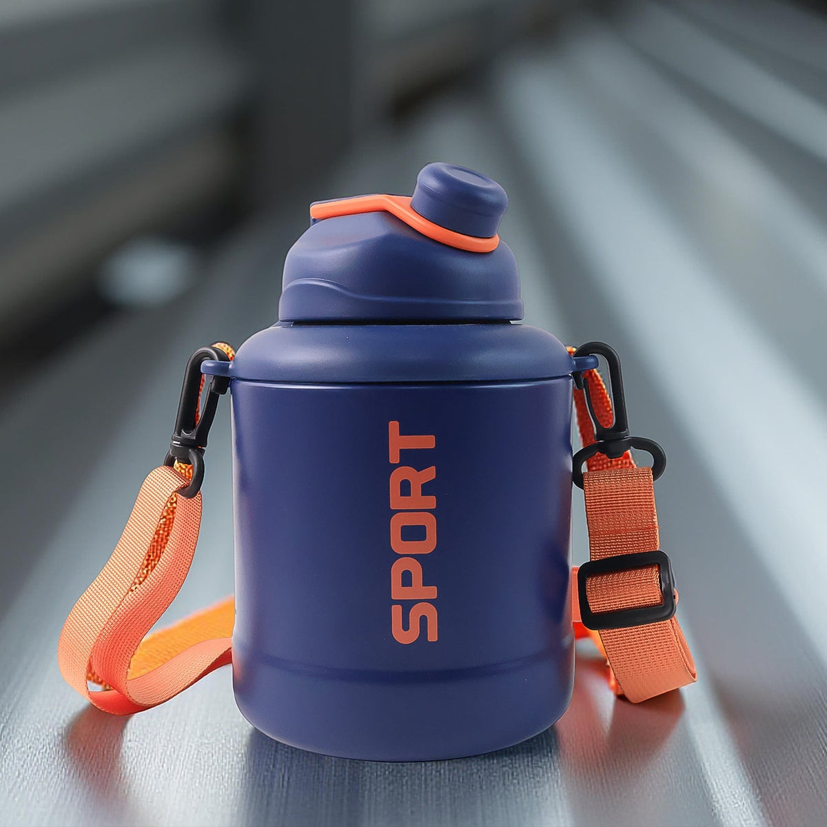 Mixed design vacuum sports bottle with easy carry strap