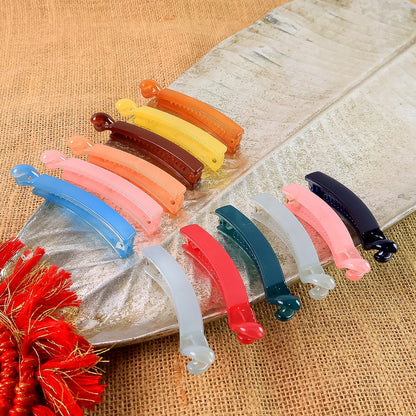 Set of 12 vibrant banana hair clips made from durable plastic