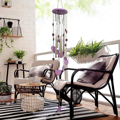 Side view of the handcrafted bamboo and aluminium wind chime with heart accents.