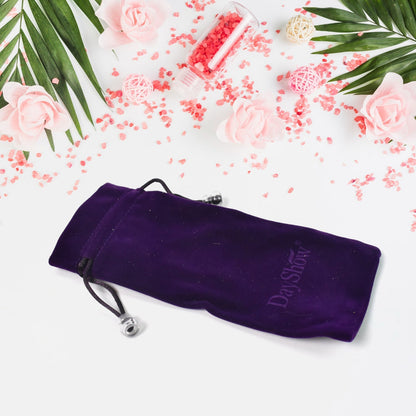 Stylish small fancy gift bag with its drawstring closure visible, ready for packaging.