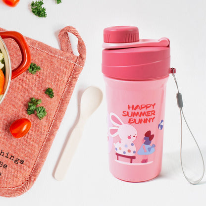 Overhead view of the complete lunch box set, including the reusable food container, bottle, and fork.