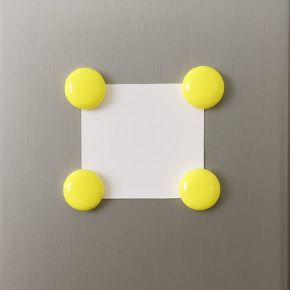 Arrangement of several white round magnetic buttons, ready for versatile use.