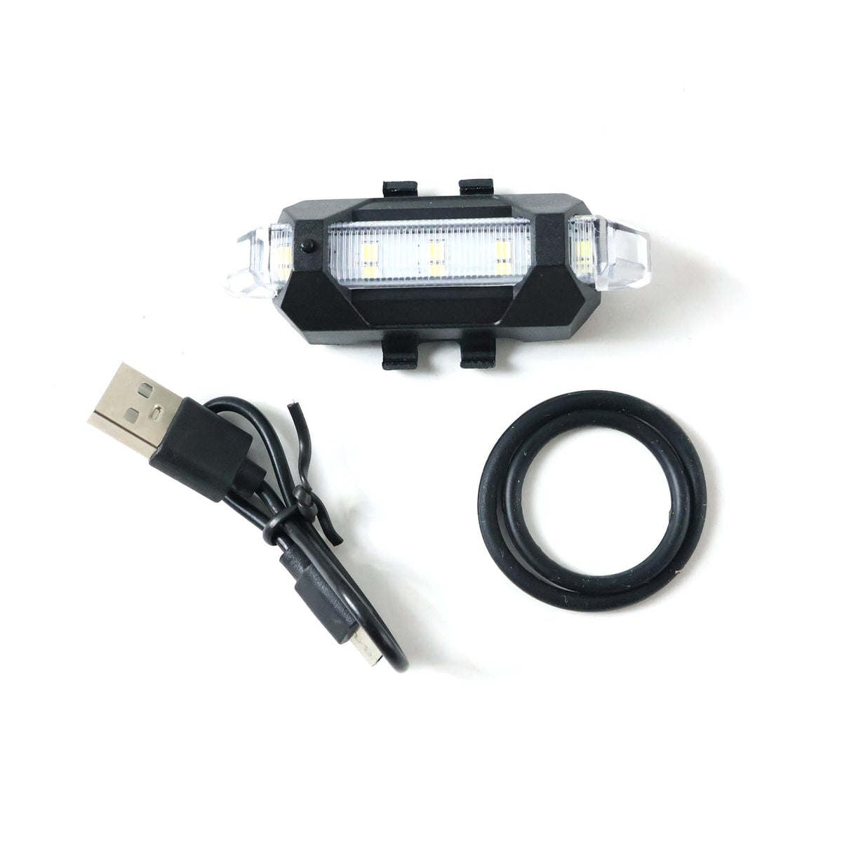 Multipurpose LED bicycle safety light attached easily, demonstrating versatile mounting.
