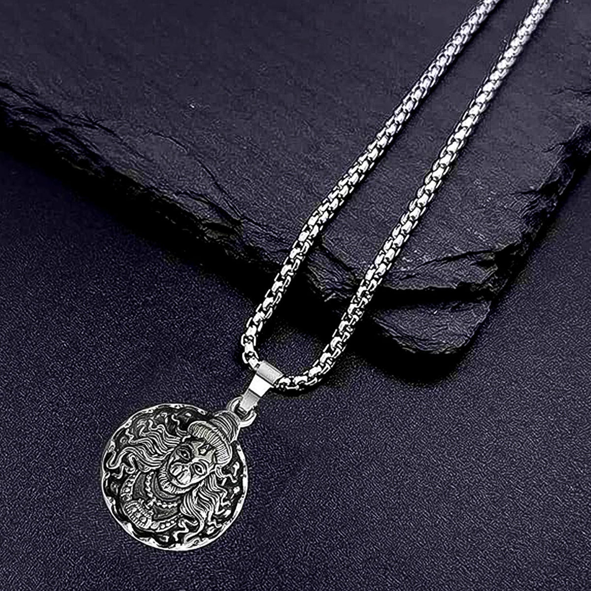 Detailed view of the Hanuman Locket with its accompanying chain.