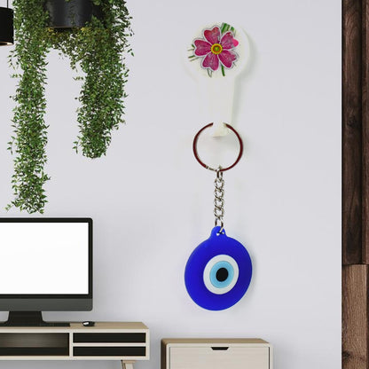 Evil eye charm keychain attached to keys showing protective amulet design