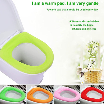 Hand demonstrating the stretchability of the cloth toilet seat cover for universal fit.