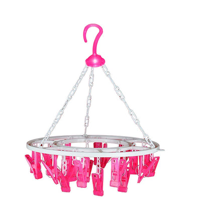 Sturdy multicolour round drying hanger with 24 clips, hanging various small items.