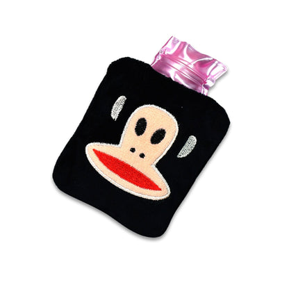 The mini hot water bag placed on a shoulder to provide muscle comfort and warmth.