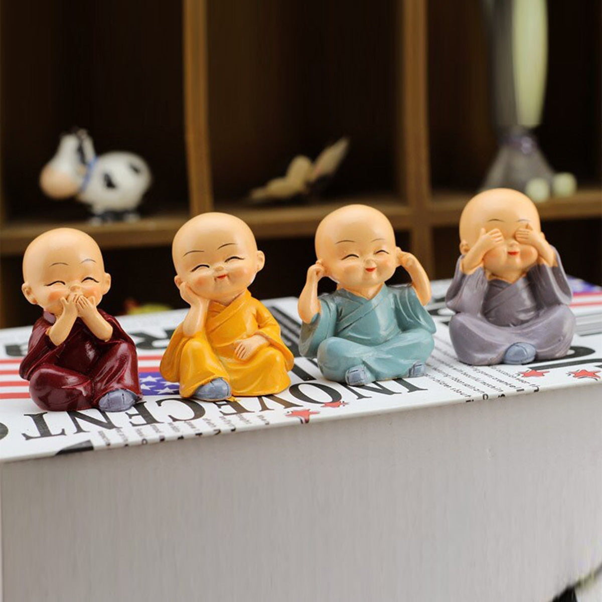 Lightweight baby Buddha showpieces arranged for official space