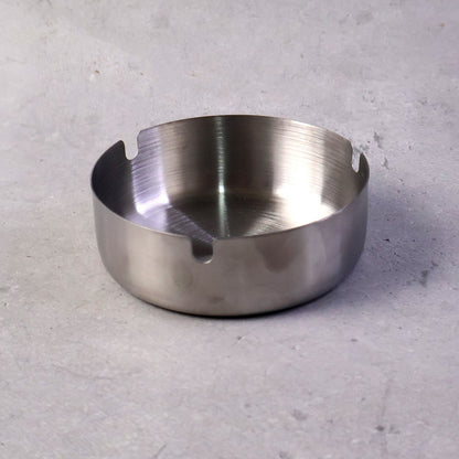 Stable tabletop ashtray with multiple slots for cigarette rests
