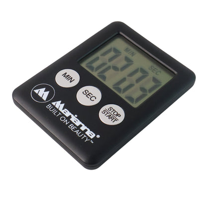 Magnetic countdown timer securely attached to a refrigerator door.