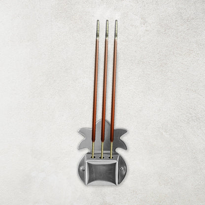 Set of three durable metal incense stick holders ideal for pooja room rituals.